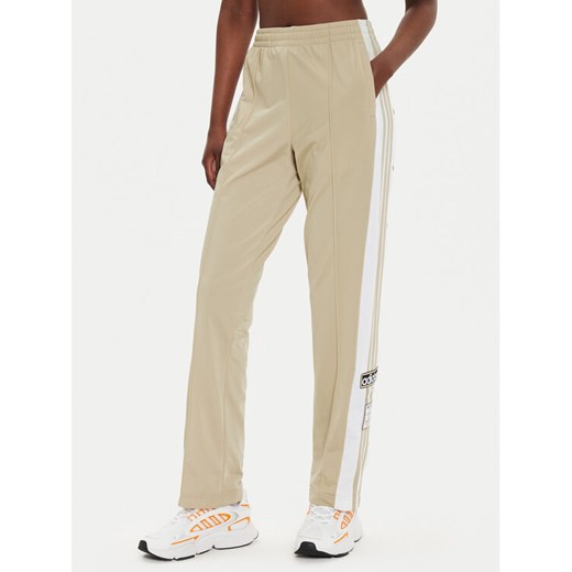 adidas Spodnie dresowe Adibreak IY2130 Beżowy Loose Fit ze sklepu MODIVO w kategorii Spodnie damskie - zdjęcie 182717437