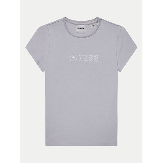 Guess T-Shirt J4RI49 J1314 Fioletowy Regular Fit ze sklepu MODIVO w kategorii Bluzki dziewczęce - zdjęcie 182718559