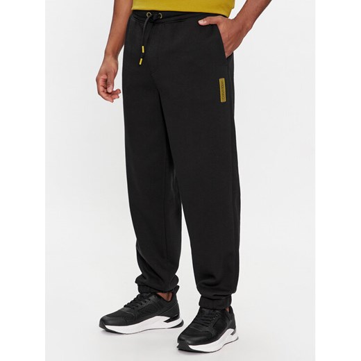 Calvin Klein Spodnie dresowe Grid Logo K10K112430 Czarny Relaxed Fit ze sklepu MODIVO w kategorii Spodnie męskie - zdjęcie 182718915
