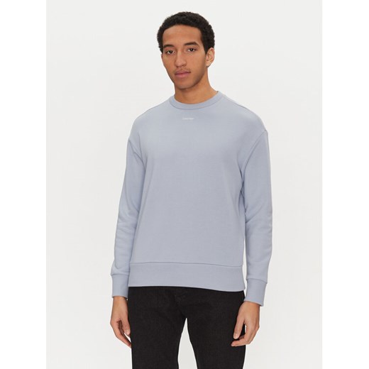 Calvin Klein Bluza Nano Logo K10K112870 Niebieski Regular Fit ze sklepu MODIVO w kategorii Bluzy męskie - zdjęcie 182719149