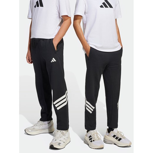 adidas Spodnie dresowe Future Icons 3-Stripes JJ4808 Czarny Regular Fit ze sklepu MODIVO w kategorii Spodnie chłopięce - zdjęcie 182719768