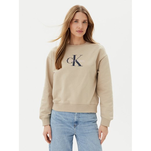 Calvin Klein Jeans Bluza LV047B234G Beżowy Relaxed Fit ze sklepu MODIVO w kategorii Bluzy damskie - zdjęcie 182720605