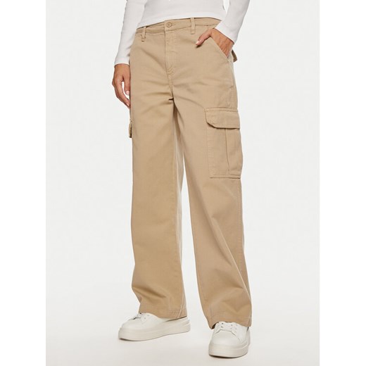 Guess Jeans Spodnie cargo W4YB61 WGCV1 Beżowy Relaxed Fit ze sklepu MODIVO w kategorii Spodnie damskie - zdjęcie 182721429