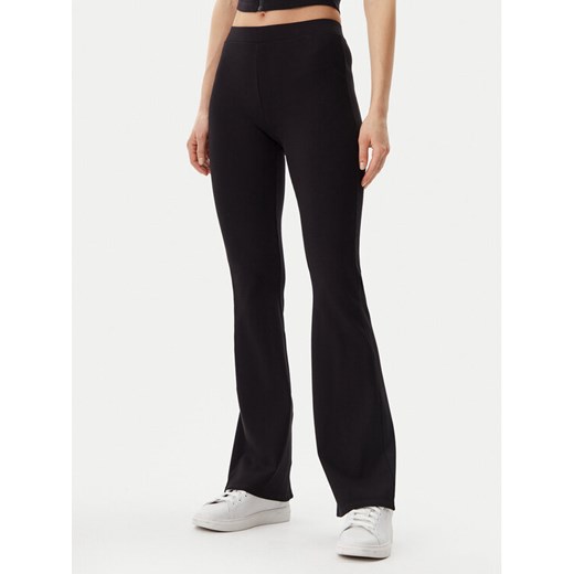 Guess Legginsy V5GB11 KCRS2 Czarny Regular Fit ze sklepu MODIVO w kategorii Spodnie damskie - zdjęcie 182721938