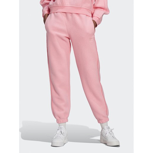 adidas Spodnie dresowe Originals HL9148 Różowy Relaxed Fit ze sklepu MODIVO w kategorii Spodnie damskie - zdjęcie 182725679