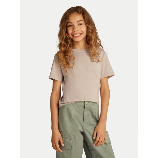 Calvin Klein Jeans T-Shirt IU0IU00683 Beżowy Regular Fit ze sklepu MODIVO w kategorii Bluzki dziewczęce - zdjęcie 182729686