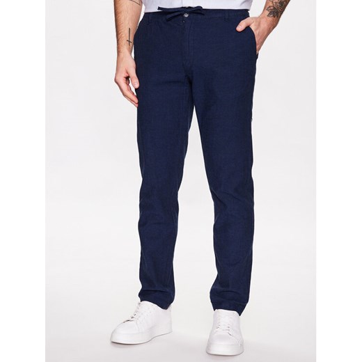 Lindbergh Spodnie materiałowe 30-008003 Niebieski Tapered Fit ze sklepu MODIVO w kategorii Spodnie męskie - zdjęcie 182731587