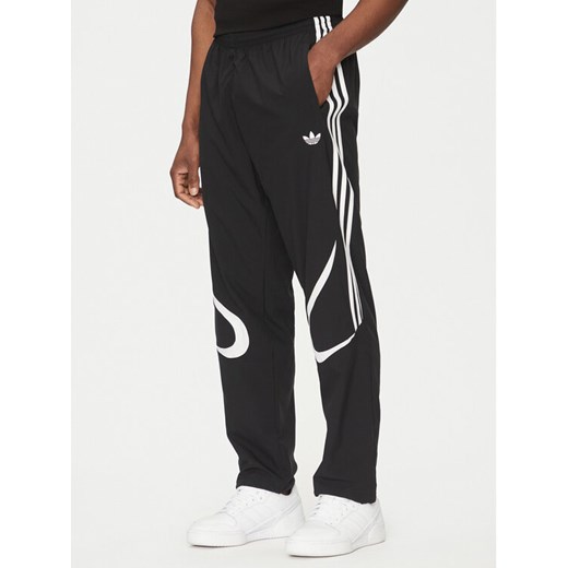 adidas Spodnie dresowe adicolor Teamgeist JC6228 Czarny Regular Fit ze sklepu MODIVO w kategorii Spodnie męskie - zdjęcie 182731618