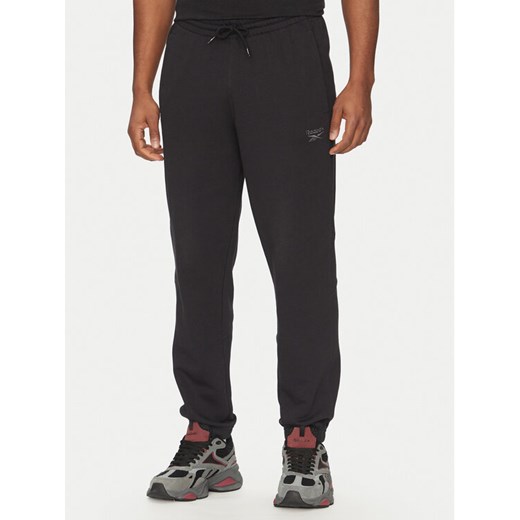 Reebok Spodnie dresowe 100214075 Czarny Regular Fit ze sklepu MODIVO w kategorii Spodnie męskie - zdjęcie 182732256