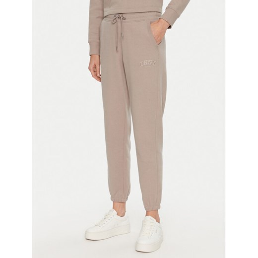 DKNY Sport Spodnie dresowe DP4P3471 Beżowy Regular Fit ze sklepu MODIVO w kategorii Spodnie damskie - zdjęcie 182732446