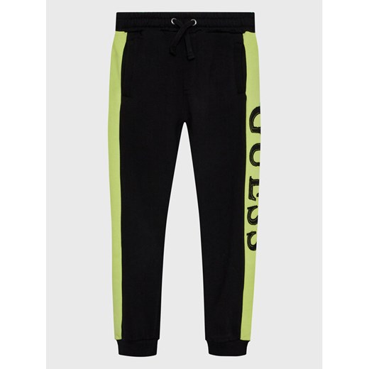 Guess Spodnie dresowe N3RQ12 KA6R3 Czarny Regular Fit ze sklepu MODIVO w kategorii Spodnie chłopięce - zdjęcie 182733548