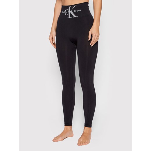 Calvin Klein Jeans Legginsy 701220429 Czarny Slim Fit ze sklepu MODIVO w kategorii Spodnie damskie - zdjęcie 182733726