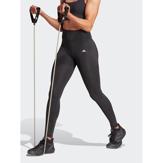 adidas Legginsy Optime IQ2688 Czarny Slim Fit ze sklepu MODIVO w kategorii Spodnie damskie - zdjęcie 182735416