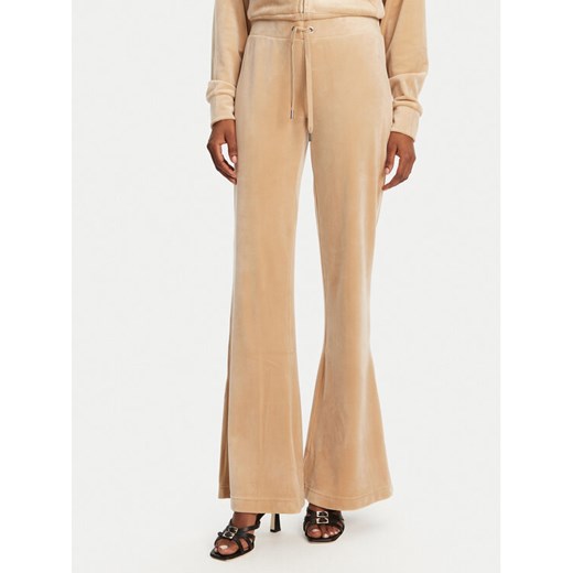 Juicy Couture Spodnie dresowe Christine JCWBJ125304 Beżowy Flared Leg ze sklepu MODIVO w kategorii Spodnie damskie - zdjęcie 182736485