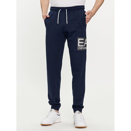 EA7 Emporio Armani Spodnie dresowe 3DPP73 PJ05Z 1554 Granatowy Regular Fit ze sklepu MODIVO w kategorii Spodnie męskie - zdjęcie 182737756