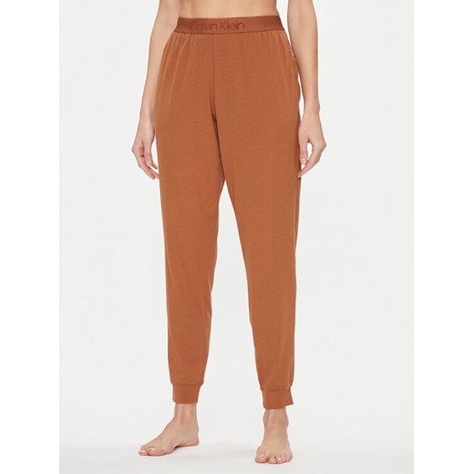 Calvin Klein Underwear Spodnie piżamowe 000QS7004E Brązowy Regular Fit ze sklepu MODIVO w kategorii Piżamy damskie - zdjęcie 182738027
