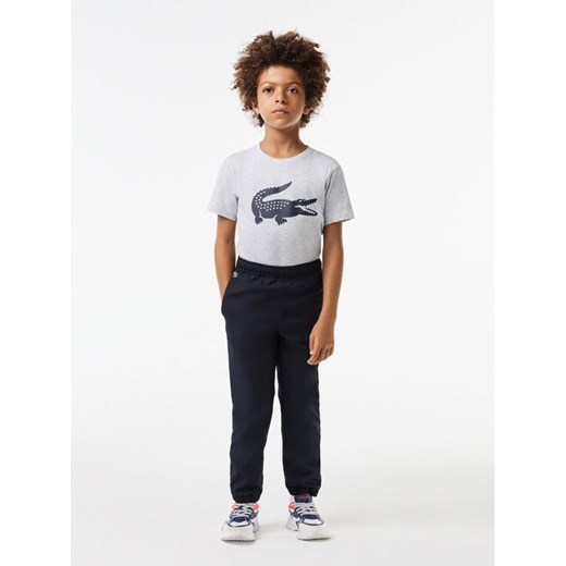 Lacoste Spodnie dresowe XJ2741 Czarny Regular Fit ze sklepu MODIVO w kategorii Spodnie chłopięce - zdjęcie 182738435