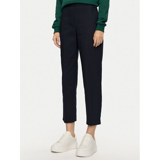 Tommy Hilfiger Chinosy Travel WW0WW43632 Granatowy Slim Fit ze sklepu MODIVO w kategorii Spodnie damskie - zdjęcie 182741509