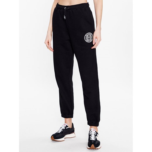Ellesse Spodnie dresowe Jigono SGR17954 Czarny Regular Fit ze sklepu MODIVO w kategorii Spodnie damskie - zdjęcie 182742218