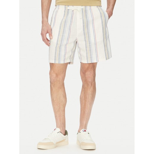 Tommy Hilfiger Szorty materiałowe DM0DM21948 Écru Regular Fit ze sklepu MODIVO w kategorii Spodenki męskie - zdjęcie 182742518