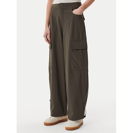 adidas Spodnie materiałowe Premium Essentials JD4785 Khaki Loose Fit ze sklepu MODIVO w kategorii Spodnie damskie - zdjęcie 182743348