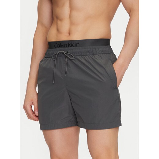 Calvin Klein Swimwear Szorty kąpielowe KM0KM01104 Szary Regular Fit ze sklepu MODIVO w kategorii Kąpielówki - zdjęcie 182744177