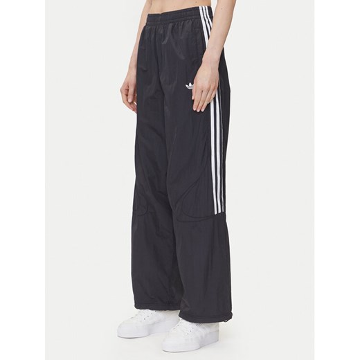 adidas Spodnie dresowe adicolor Teamgeist JD0256 Czarny Oversize ze sklepu MODIVO w kategorii Spodnie damskie - zdjęcie 182744256