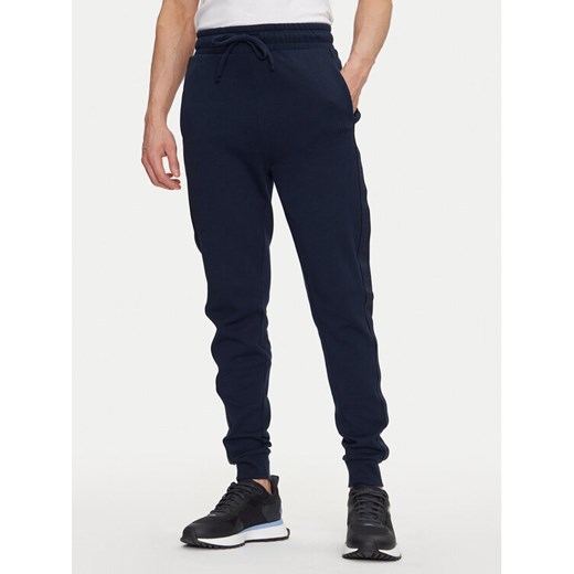 HUGO Spodnie dresowe Liam 50540918 Granatowy Regular Fit ze sklepu MODIVO w kategorii Spodnie męskie - zdjęcie 182746245