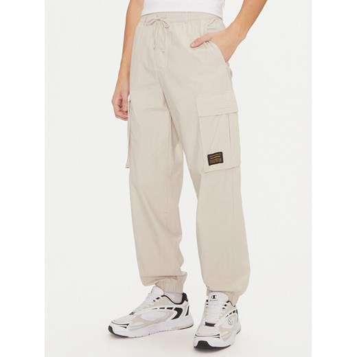 Champion Spodnie dresowe 220415 Écru Loose Fit ze sklepu MODIVO w kategorii Spodnie męskie - zdjęcie 182746275