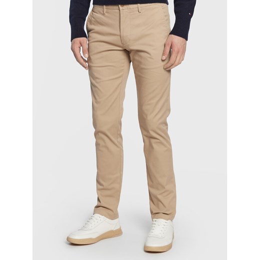 Tommy Hilfiger Chinosy Core Bleecker MW0MW28883 Beżowy Slim Fit ze sklepu MODIVO w kategorii Spodnie męskie - zdjęcie 182748777