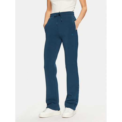 Guess Spodnie dresowe V3RB21 K7UW2 Niebieski Regular Fit ze sklepu MODIVO w kategorii Spodnie damskie - zdjęcie 182748839