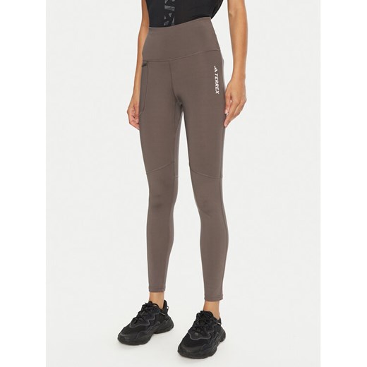 adidas Legginsy Terrex Multi IP6883 Brązowy Slim Fit ze sklepu MODIVO w kategorii Spodnie damskie - zdjęcie 182749278