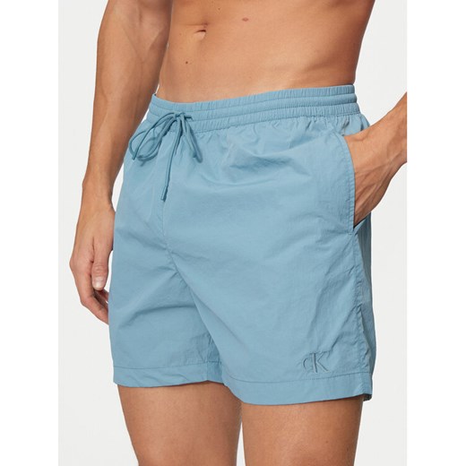 Calvin Klein Swimwear Szorty kąpielowe KM0KM01080 Niebieski Regular Fit ze sklepu MODIVO w kategorii Kąpielówki - zdjęcie 182749836