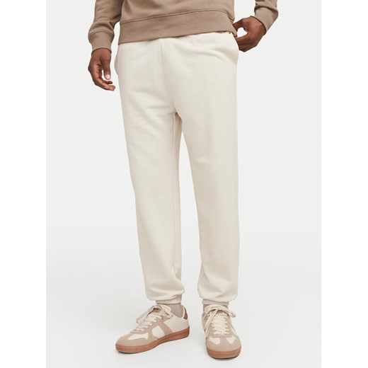 Jack&Jones Spodnie dresowe Morgan 12257964 Beżowy Regular Fit ze sklepu MODIVO w kategorii Spodnie męskie - zdjęcie 182751145