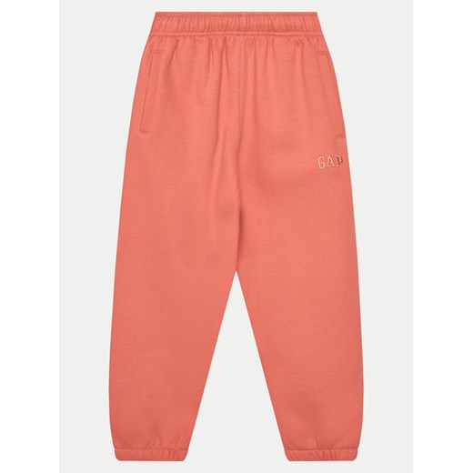 Gap Spodnie dresowe 741404-00 Koralowy Relaxed Fit ze sklepu MODIVO w kategorii Spodnie dziewczęce - zdjęcie 182752486