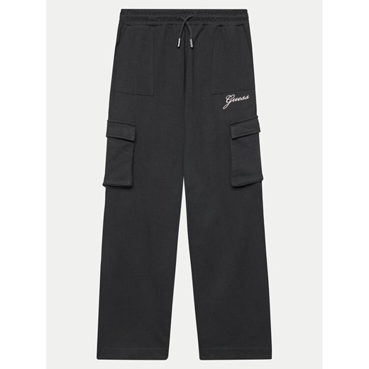 Guess Spodnie dresowe J4YQ13 KA6R3 Czarny Relaxed Fit ze sklepu MODIVO w kategorii Spodnie chłopięce - zdjęcie 182752717