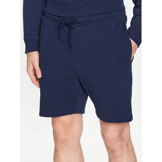 Tommy Jeans Szorty sportowe College DM0DM16331 Granatowy Regular Fit ze sklepu MODIVO w kategorii Spodenki męskie - zdjęcie 182753538