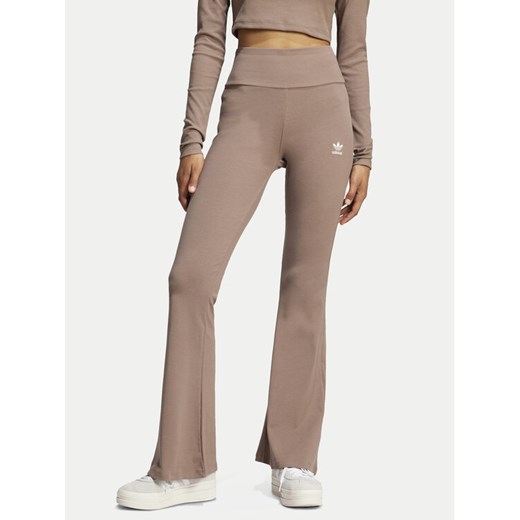 adidas Legginsy Essentials JC9023 Beżowy Flare Fit ze sklepu MODIVO w kategorii Spodnie damskie - zdjęcie 182755028