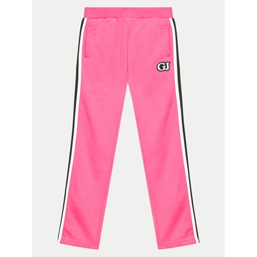 Guess Spodnie dresowe J4YQ12 KA6R4 Różowy Relaxed Fit ze sklepu MODIVO w kategorii Spodnie dziewczęce - zdjęcie 182755136