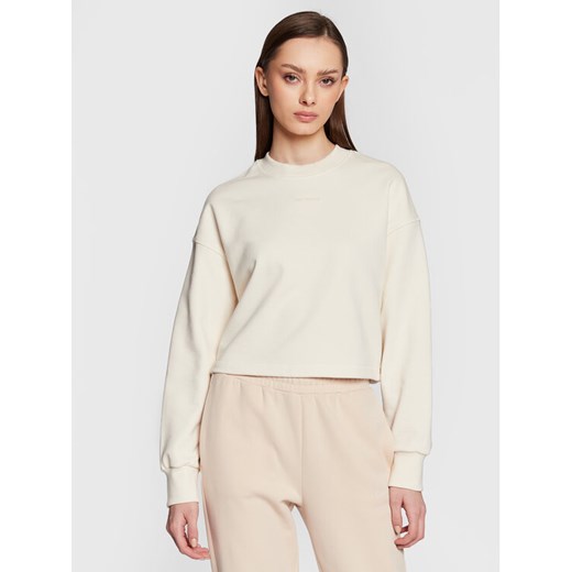 New Balance Bluza Athletics Nature WT23555 Écru Relaxed Fit ze sklepu MODIVO w kategorii Bluzy damskie - zdjęcie 182758695