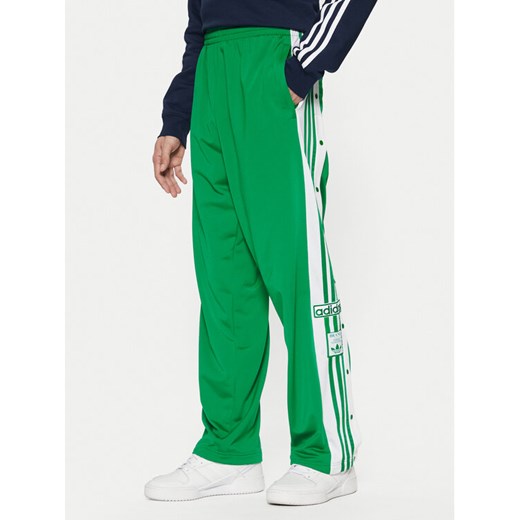 adidas Spodnie dresowe Adibreak JP3762 Zielony Regular Fit ze sklepu MODIVO w kategorii Spodnie męskie - zdjęcie 182759976
