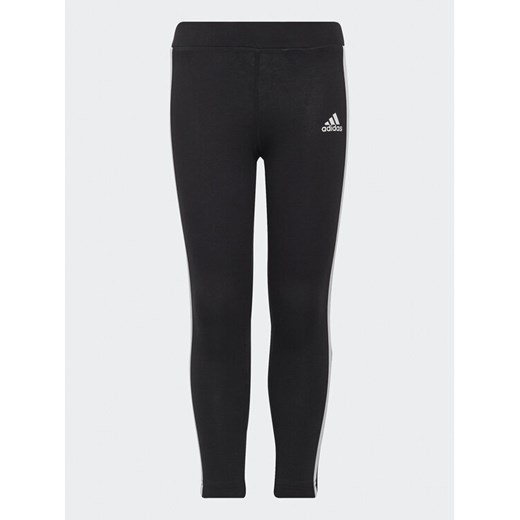 adidas Legginsy Essentials 3-Stripes Leggings H65800 Czarny Fitted Fit ze sklepu MODIVO w kategorii Spodnie dziewczęce - zdjęcie 182760366