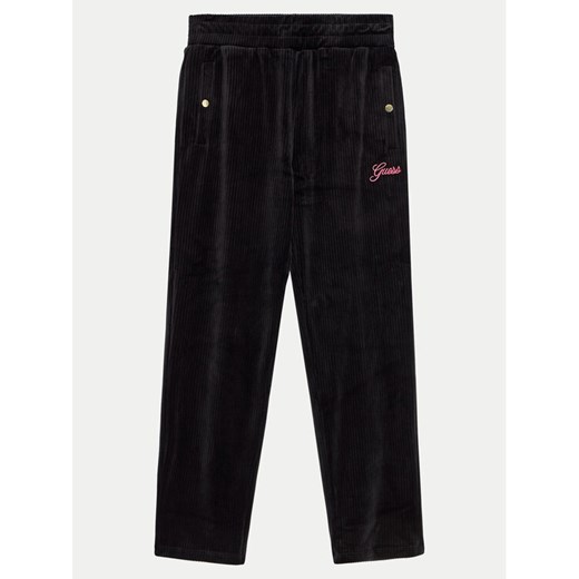 Guess Spodnie dresowe J4BQ13 KCH92 Czarny Relaxed Fit ze sklepu MODIVO w kategorii Spodnie chłopięce - zdjęcie 182760959