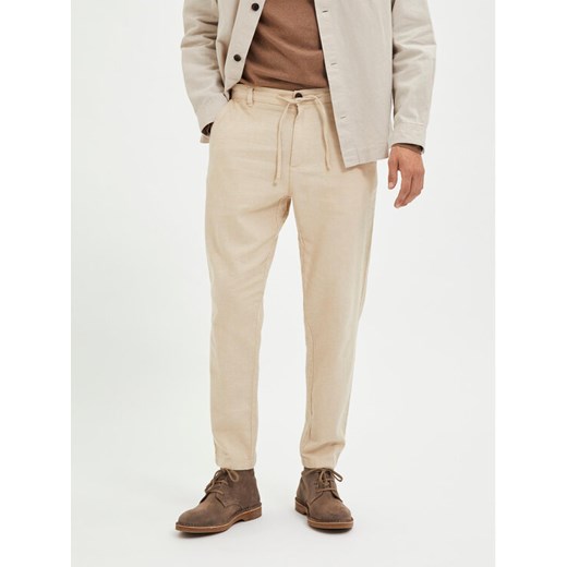 Selected Homme Chinosy 16087636 Beżowy Slim Tapered Fit ze sklepu MODIVO w kategorii Spodnie męskie - zdjęcie 182763037