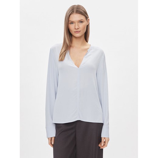 Tommy Hilfiger Bluzka WW0WW40529 Błękitny Relaxed Fit ze sklepu MODIVO w kategorii Bluzki damskie - zdjęcie 182763815