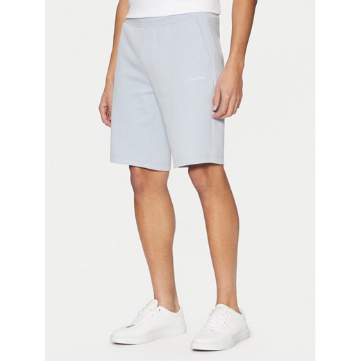 Calvin Klein Szorty sportowe Micro Logo K10K111208 Niebieski Regular Fit ze sklepu MODIVO w kategorii Spodenki męskie - zdjęcie 182765047