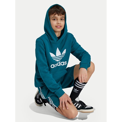 adidas Bluza Trefoil IY7440 Turkusowy Regular Fit ze sklepu MODIVO w kategorii Bluzy chłopięce - zdjęcie 182765876