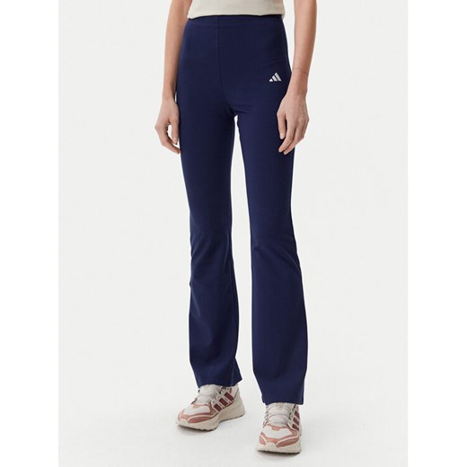 adidas Legginsy Essentials Small Logo JD3073 Granatowy Flare Fit ze sklepu MODIVO w kategorii Spodnie damskie - zdjęcie 182766555