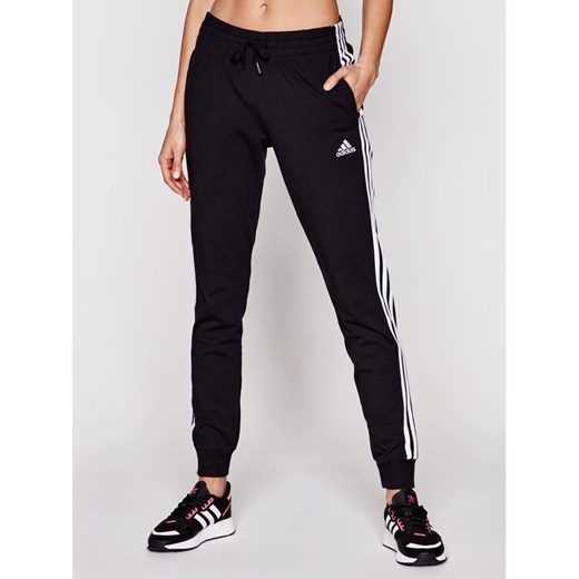 adidas Spodnie dresowe 3-Stripes GM5542 Czarny Slim Fit ze sklepu MODIVO w kategorii Spodnie damskie - zdjęcie 183550525