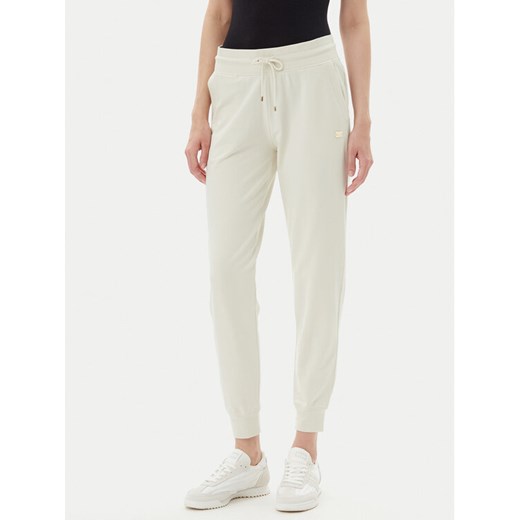 EA7 Emporio Armani Spodnie dresowe 7W000082 AF13135 U1112 Beżowy Regular Fit ze sklepu MODIVO w kategorii Spodnie damskie - zdjęcie 183578489